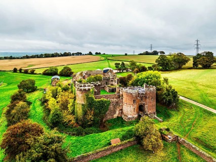 Autumn Colours over ruins of Pembridge Castle or Newland Castle from a drone, Herefordshire,