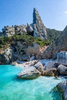 Light blue clear sea on a dream beach on Cala Goloritzé, picturesque rocky coast, steep coast with