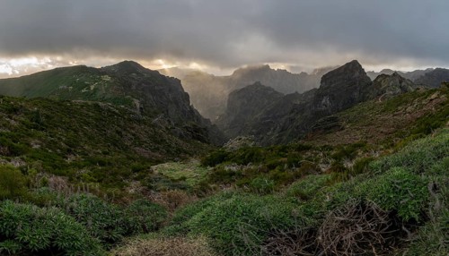 Sunset at Pico do Arieiro, sun shining through clouds, sunbeam, hiking trail PR1, Madeira, Portugal