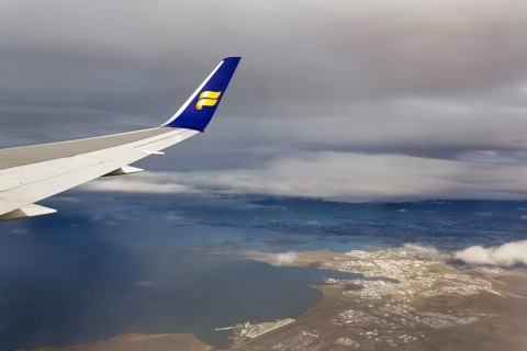 Wing, airplane, Icelandair airline logo, flying to Boston, view of Reykjavik, aerial view, Iceland