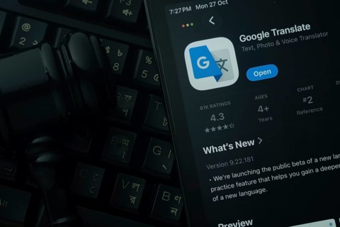 Dhaka, Bangladesh- 28 Oct 2025: An iPad displaying the Google Translate app against a judge's gavel