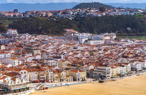 View from Leuct Tower towards orange tiled roofs in the town of Nazare, Estremadura, Portugal