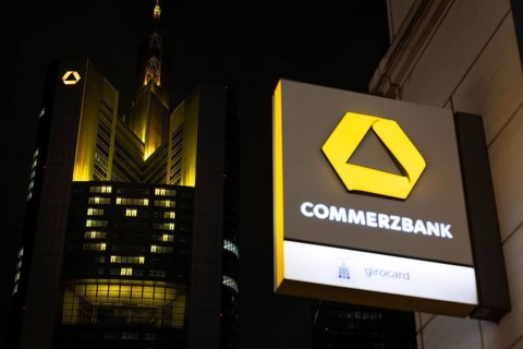 A yellow heart glows on the façade of the Commerzbank Tower in Frankfurt am Main at Christmas time
