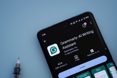 Dhaka, Bangladesh- 29 May 2025: On a blue surface, a smartphone displays the Grammarly app within