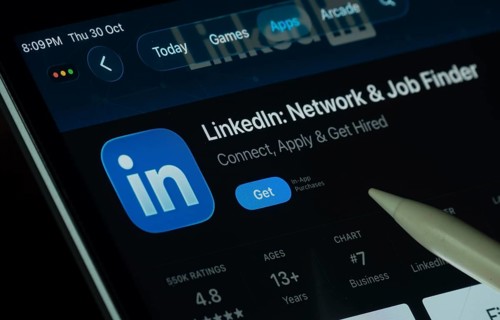 Dhaka, Bangladesh- 30 Oct 2025: LinkedIn app displayed on a iPad screen in dark mode with a digital
