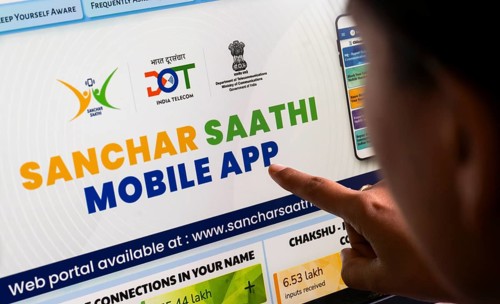 In this photo illustration, a person downloads the Sanchar Saathi mobile application on an iPhone,