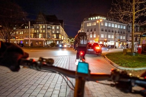 Cycling in the city, in the dark, in the evening, inner-city road, bicycle road, two-wheeler