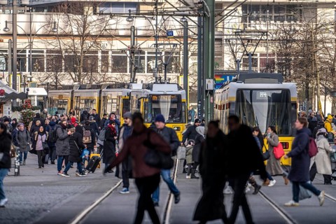 Trams at Alexanderplatz in Berlin, passers-by, Germany