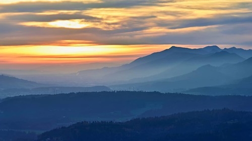 View of the Jura foothills from the Gisliflue, in the light of the setting sun, Talheim, Canton,