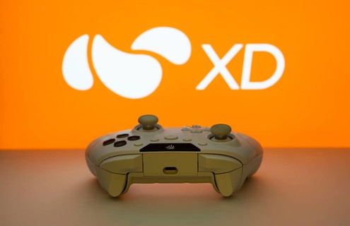 Dhaka, Bangladesh- 14 Nov 2025: A close-up of a white gamepad with the XD seen on screen in the