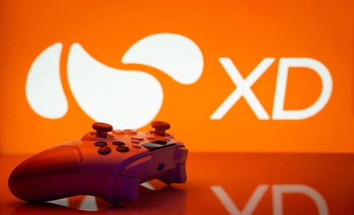 Dhaka, Bangladesh- 14 Nov 2025: A close-up of a white gamepad with the XD seen on screen in the