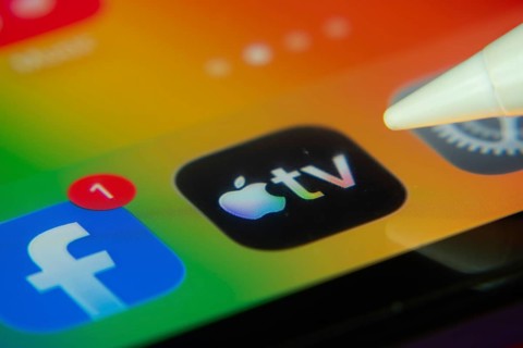 16 Nov 2025- Dhaka, Bangladesh: Stylus touching the Apple TV app icon on a smartphone screen