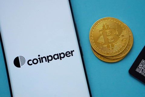Dhaka, Bangladesh- 03 Sep 2025: Coinpaper logo on smartphone screen near Bitcoin coin and QR code