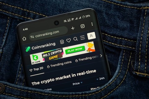 Dhaka, Bangladesh- 15 June 2025: A smartphone displaying the Coinranking web interface peeks out of