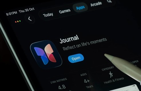 Dhaka, Bangladesh- 30 Oct 2025: Apple Journal app displayed on a iPad screen in dark mode with a