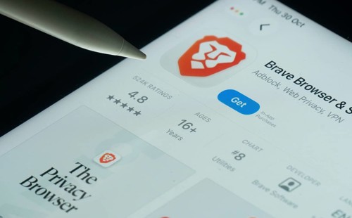 Dhaka, Bangladesh- 30 Oct 2025: Brave browser app on a iPad screen with a pen pointing at the