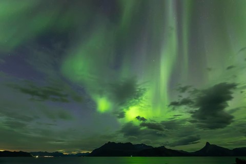 Northern lights at dawn over Sørfolda Fjord near Kjerringøy between Bodø and Sørfold in Norway