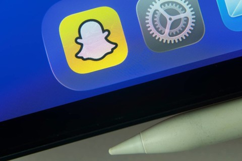 16 Nov 2025- Dhaka, Bangladesh: Snapchat and other app icons with a digital pen on a iPad screen