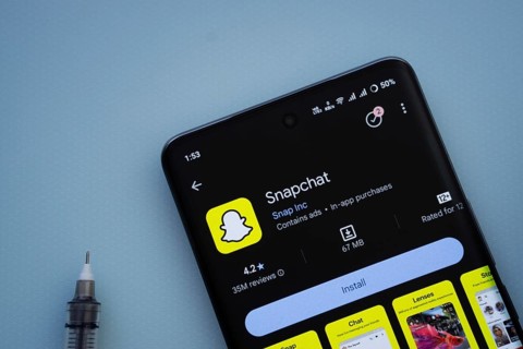 Dhaka, Bangladesh- 29 May 2025: On a blue surface, a smartphone displays the Snapchat app within
