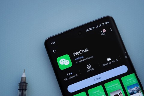 Dhaka, Bangladesh- 29 May 2025: On a blue surface, a smartphone displays the wechat app within the