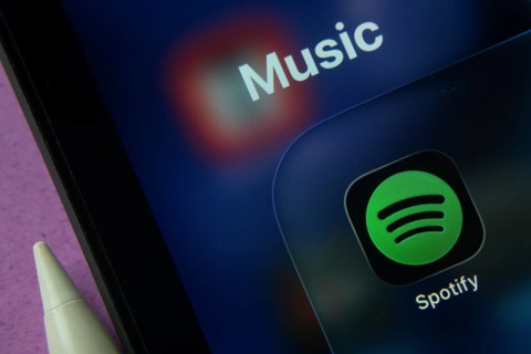 16 Nov 2025- Dhaka, Bangladesh: Close-up of Spotify app icons on a iPad screen