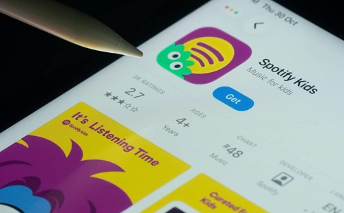 Dhaka, Bangladesh- 30 Oct 2025: Spotify Kids app on a iPad screen with a pen pointing at the
