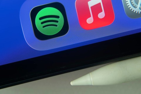 16 Nov 2025- Dhaka, Bangladesh: Spotify and Apple Music and other app icons with a digital pen on a