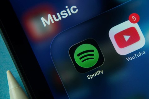 16 Nov 2025- Dhaka, Bangladesh: Close-up of Spotify and Youtube app icons on a iPad screen
