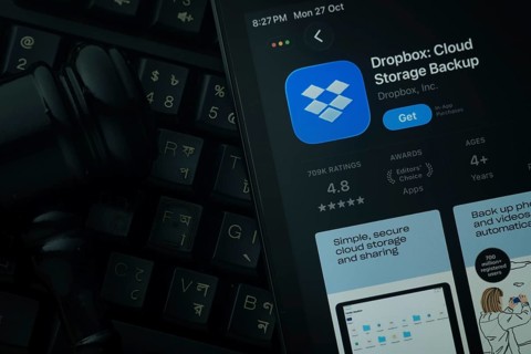 Dhaka, Bangladesh- 28 Oct 2025: An iPad displaying the Dropbox app against a judge's gavel and dark