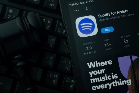 Dhaka, Bangladesh- 28 Oct 2025: An iPad displaying the Spotify for Artist app against a judge's