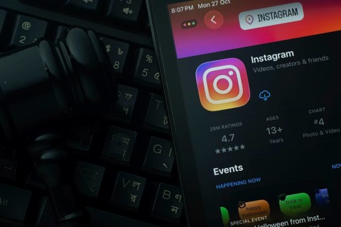 Dhaka, Bangladesh- 28 Oct 2025: An iPad displaying the Instagram app against a judge's gavel and