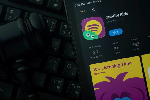 Dhaka, Bangladesh- 28 Oct 2025: An iPad displaying the Spotify Kids app against a judge's gavel and