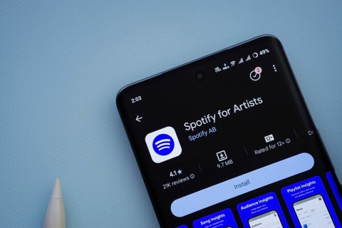 Dhaka, Bangladesh- 29 May 2025: On a blue surface, a smartphone displays the Spotify for Artists