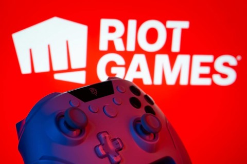 Dhaka, Bangladesh- 14 Nov 2025: A close-up of a gamepad with the Riot Games seen on screen in the