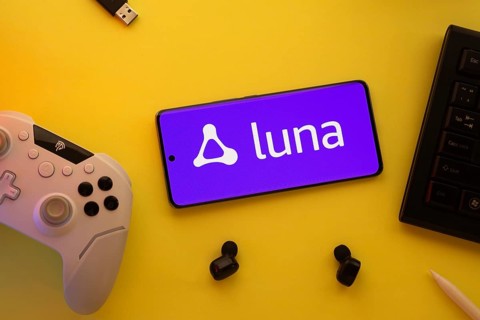 Dhaka, Bangladesh- 23 Mar 2025: Smartphone with Amazon Luna logo, game controller, and earbuds on a