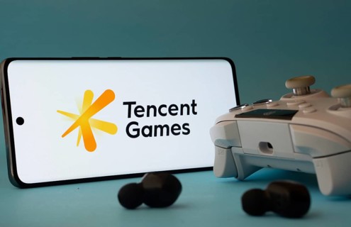 Dhaka, Bangladesh- 23 Mar 2025: A smartphone with a Tencent Games icon next to a controller and