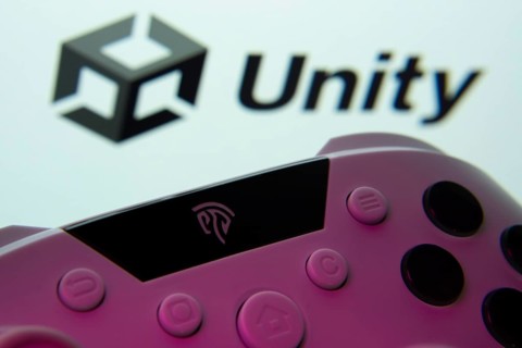 Dhaka, Bangladesh- 14 Nov 2025: A close-up of a gamepad with the Unity seen on screen in the