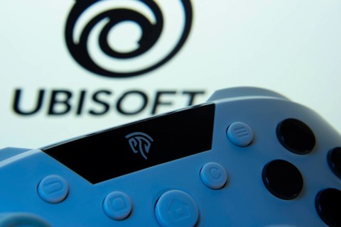 Dhaka, Bangladesh- 14 Nov 2025: A close-up of a gamepad with the Ubisoft seen on screen in the