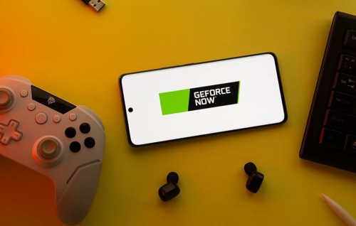 Dhaka, Bangladesh- 23 Mar 2025: Smartphone with Geforce Now logo, game controller, and earbuds on a