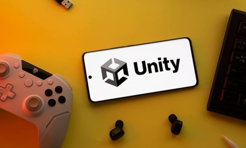 Dhaka, Bangladesh- 23 Mar 2025: Smartphone with Unity logo, game controller, and earbuds on a