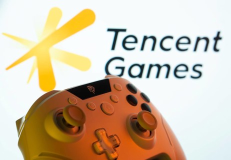 Dhaka, Bangladesh- 14 Nov 2025: A close-up of a gamepad with the Tencent Games seen on screen in