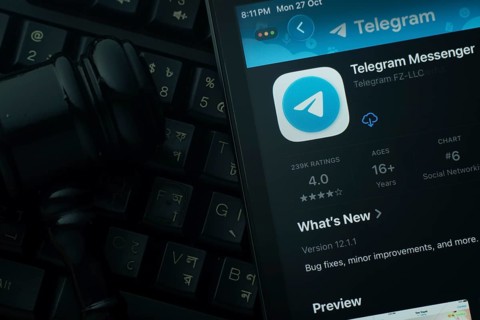 Dhaka, Bangladesh- 28 Oct 2025: An iPad displaying the Telegram app against a judge's gavel and