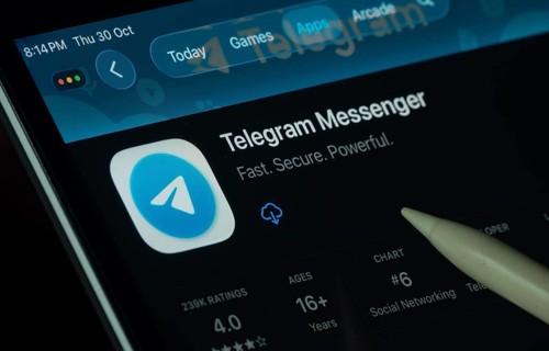 Dhaka, Bangladesh- 30 Oct 2025: Telegram app displayed on a iPad screen in dark mode with a digital