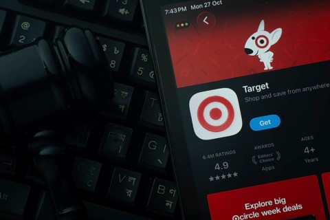 Dhaka, Bangladesh- 28 Oct 2025: An iPad displaying the Target app against a judge's gavel and dark