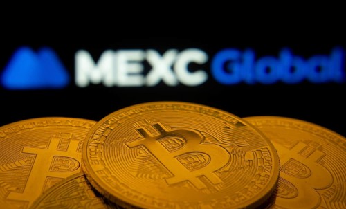 Dhaka, Bangladesh- 03 Sep 2025: Close-up of Bitcoin coins with the MEXC Global logo visible on a