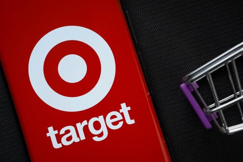 Dhaka, Bangladesh- 03 July 2025: A smartphone displaying the Target logo next to a miniature