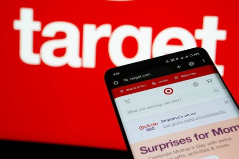 Dhaka, Bangladesh- 03 July 2025: Smartphone displaying Target web interface against Target logo