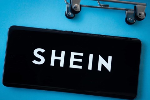 Dhaka, Bangladesh- 03 July 2025: Smartphone screen showing the SHEIN logo with shopping cart wheels