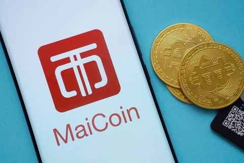 Dhaka, Bangladesh- 03 Sep 2025: MaiCoin logo on smartphone screen near Bitcoin coin and QR code on