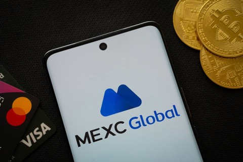 Dhaka, Bangladesh- 06 Sep 2025: Smartphone displaying MEXC Global logo surrounded by Bitcoin coins